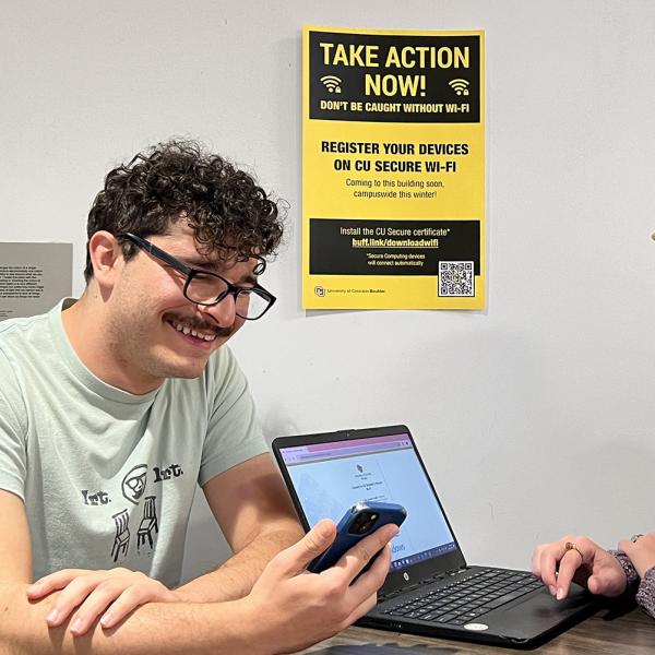 campus community members working on laptops