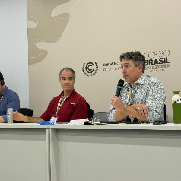 Max Boykoff speaks on a panel at COP30