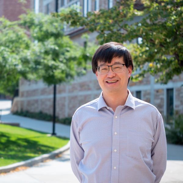 Jun Ye standing outdoors