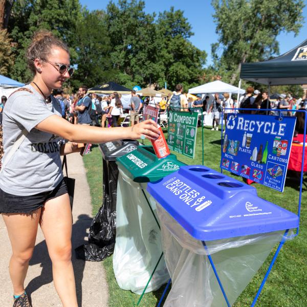 campus community member using recycle bin
