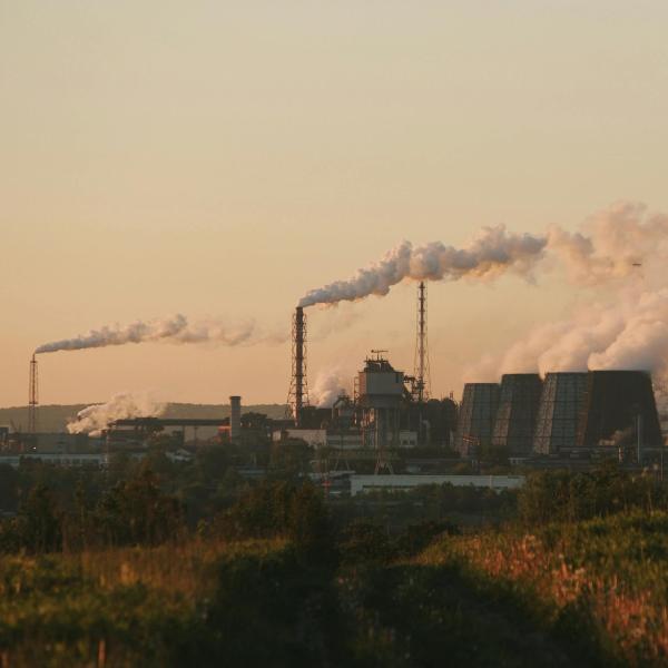 Smoke coming out of the chimneys in an industrial area