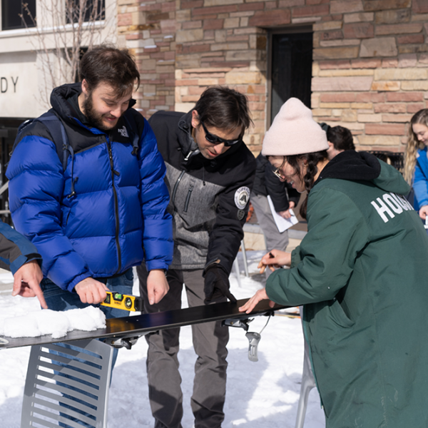 Engineering students working with snow