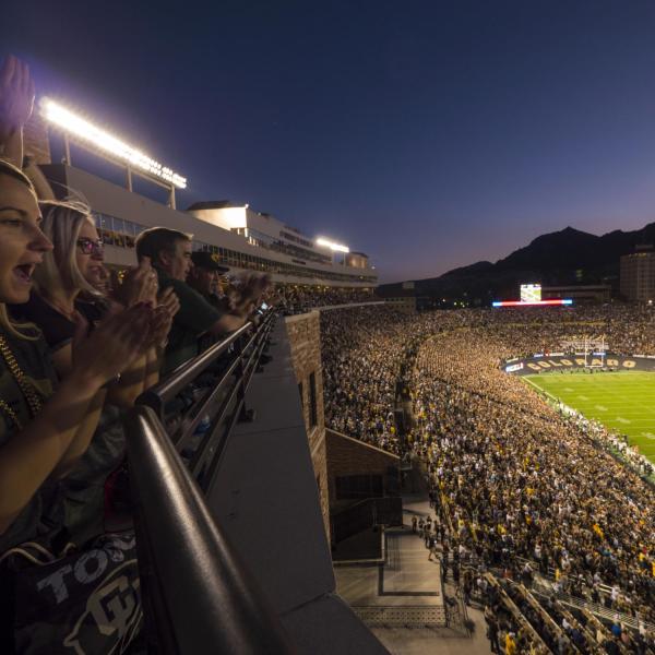 Night-time football game at Folsom Field