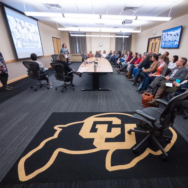 CU Buff rug in focus during a Diversity and Inclusion Summit session