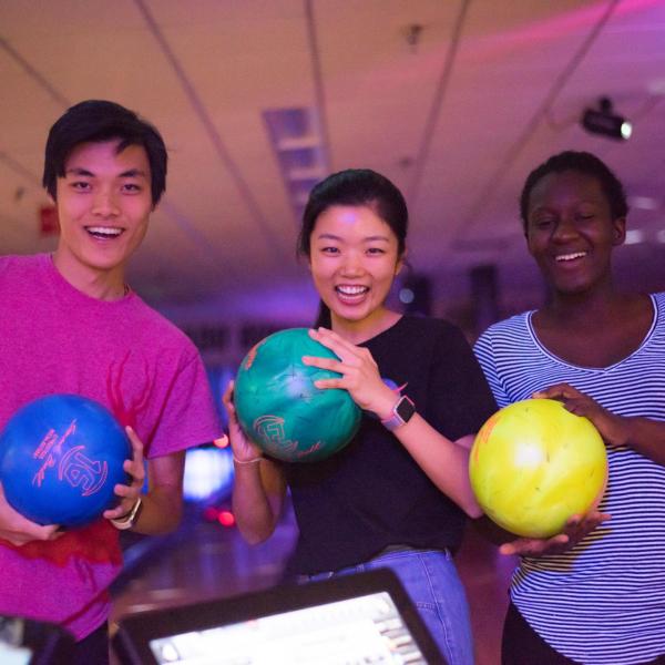 Students bowling in the Connection