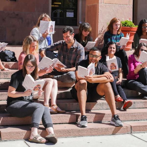 People reading on the steps of Norlin Library
