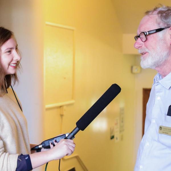 A person recording a podcast