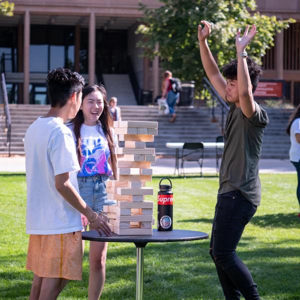Students play with giant Jenga blocks during CU Unity Fair