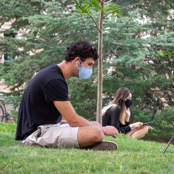 Students, staff and faculty, all wearing facial coverings and practicing proper social distancing protocols, participate in classes and study on the first day of the 2020 Fall semester on the CU Boulder Campus. (Photo by Glenn Asakawa/University of Colorado)