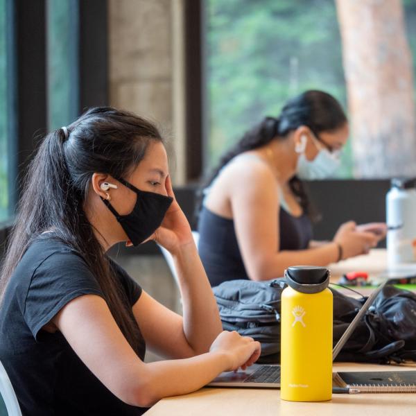 A student studying in the Engineering Center on the first day of the Fall 2020 semester. (Photo by Glenn Asakawa/University of Colorado)