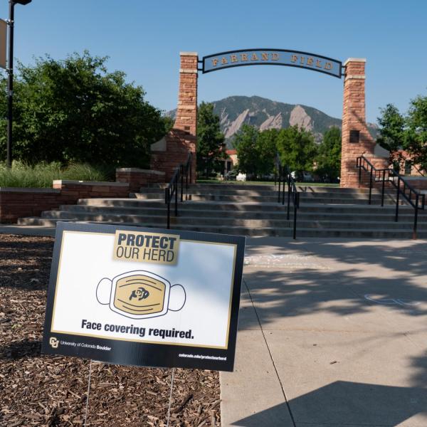 A Protect Our Herd–face covering required sign at the entrance of Farrand Field