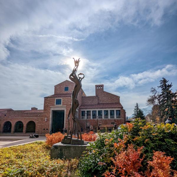 statue outside of the UMC during fall