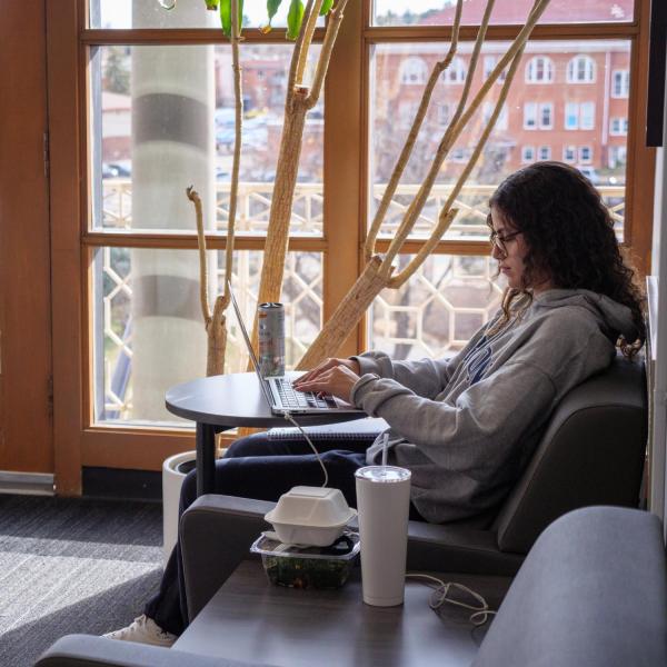 A student studies on the 5th floor of the UMC