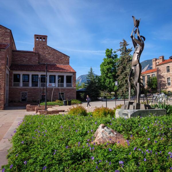 A sculpture and a flower bed outside the UMC
