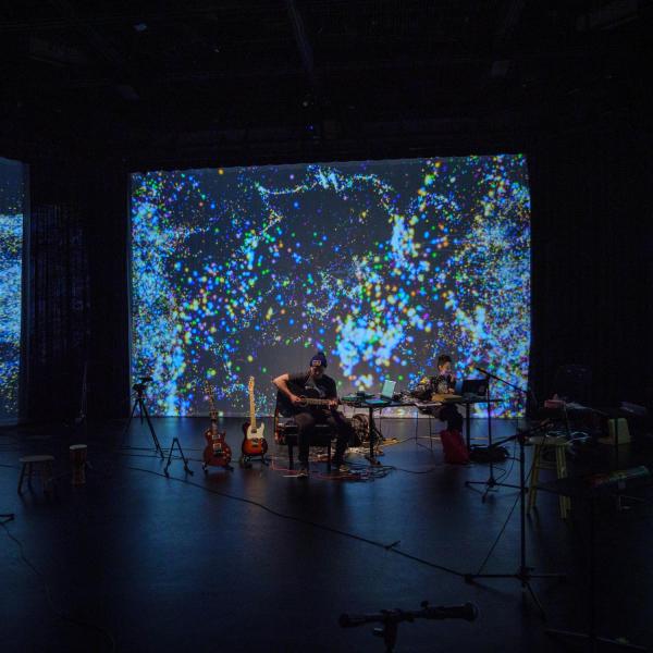 Musician plays in the ATLAS Black Box theater during the 2022 Culture Crawl