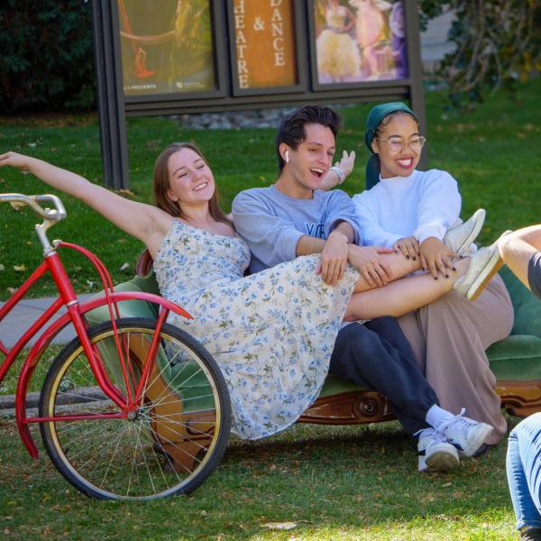 Campus community members pose at an outdoor photo booth