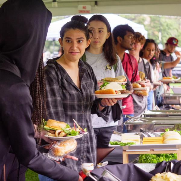 Students make plates of food in a buffet line during CUnity Fest