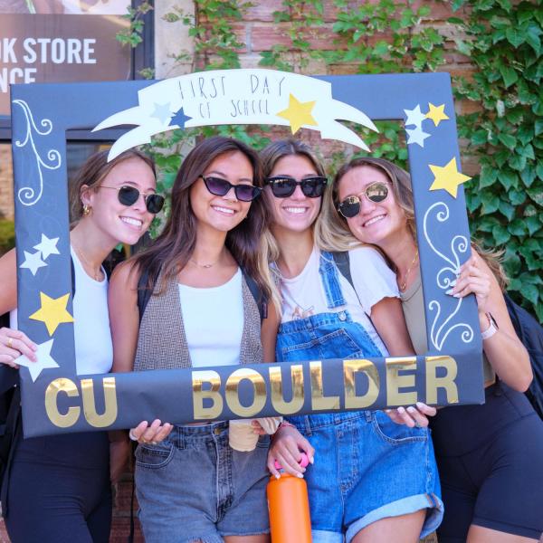Students pose for a photo in a CU Boulder frame on the first day of classes in 2022