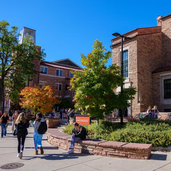 campus community members walking on campus during fall
