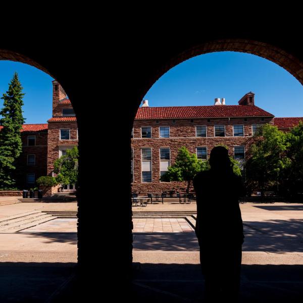 silhouette of a person near the UMC fountain area
