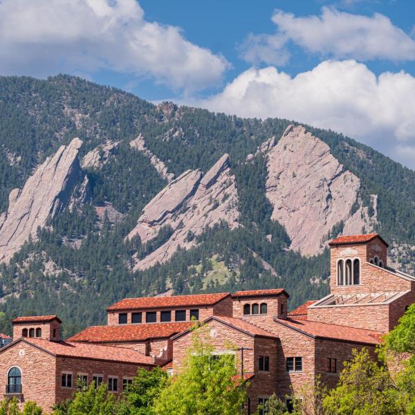 top of a campus building with Flatirons in the background