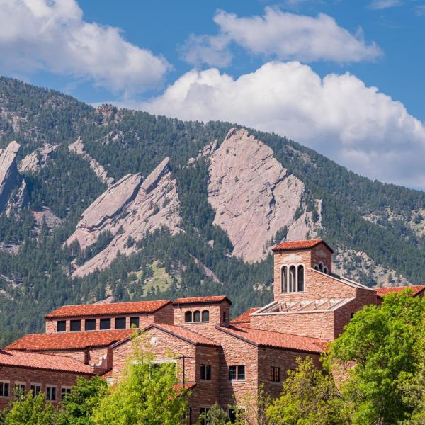 top of a campus building with Flatirons in the background