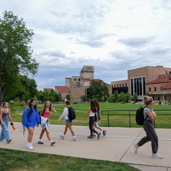 students walking on campus on the first day of classes