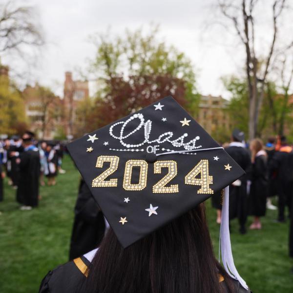 A decorated graduation cap during commencement ceremony