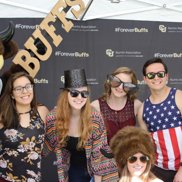 Graduating Buffs pose for photobooth photo at Grad Bash 2017