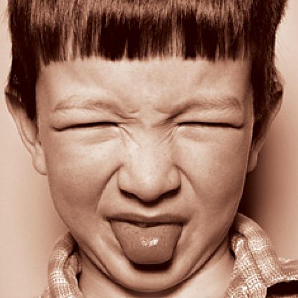 A child with a disgusted face