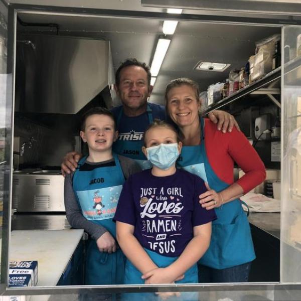 Jason, Suzi, Jacob and Sami Jewett pause from food preparation in their Bamen Ramen food truck.