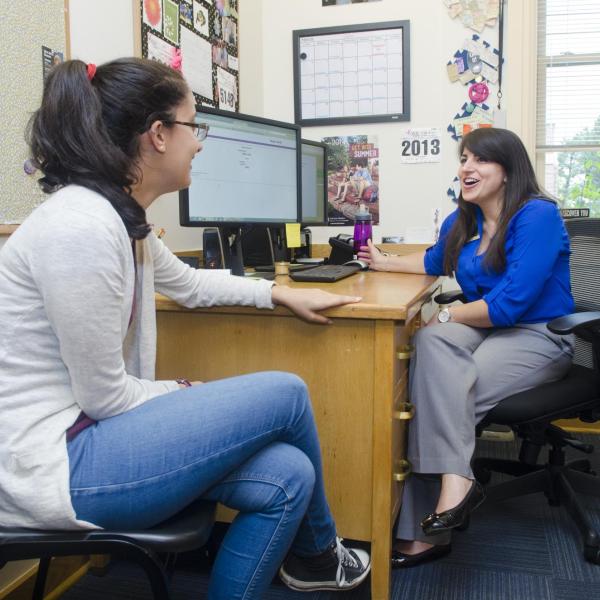 Academic advisor meets with a student