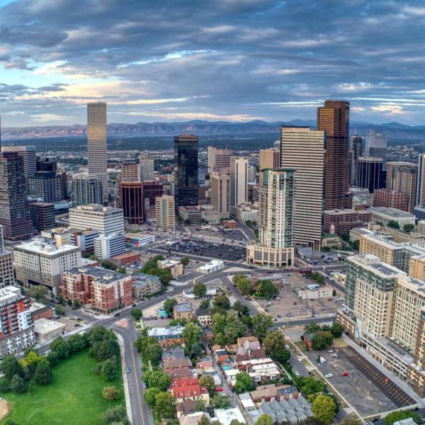 Daybreak over downtown Denver with a view of the Rocky Mountains to the west