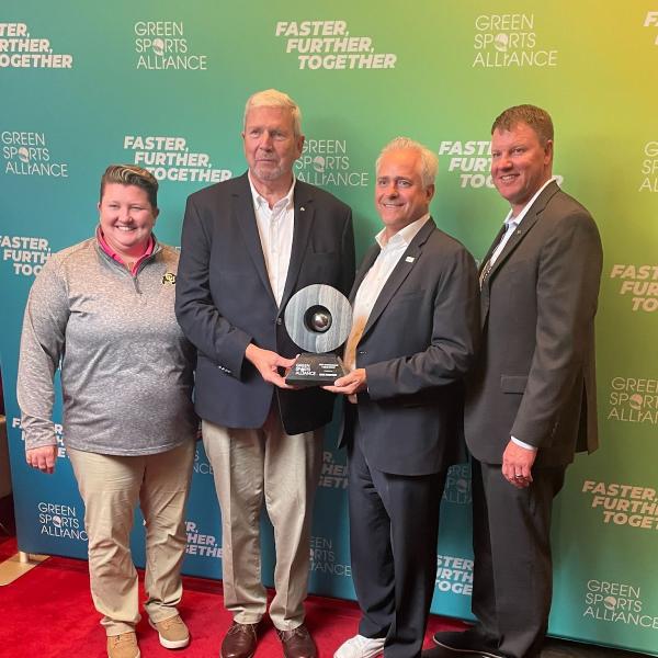 Angie Gilbert, Dave Newport, Jamie Zaninovich and Jason Depaepe receiving an award