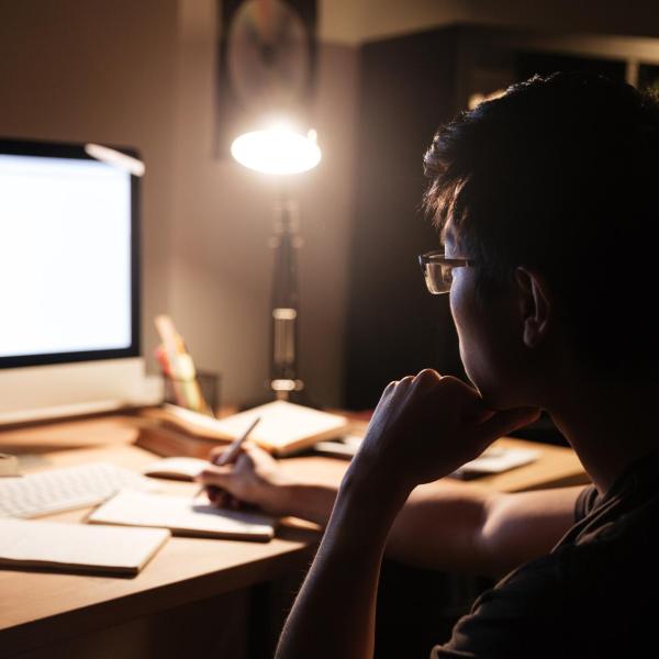 person working on a computer at night