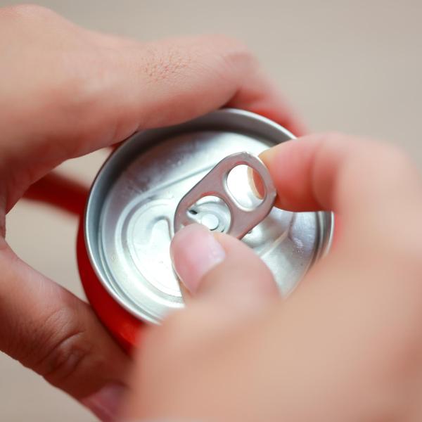 Person opening up a canned beverage