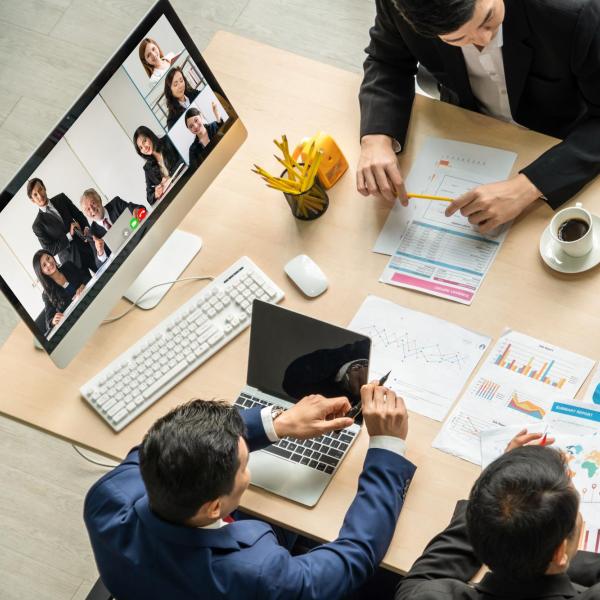 Team members in a hybrid meeting