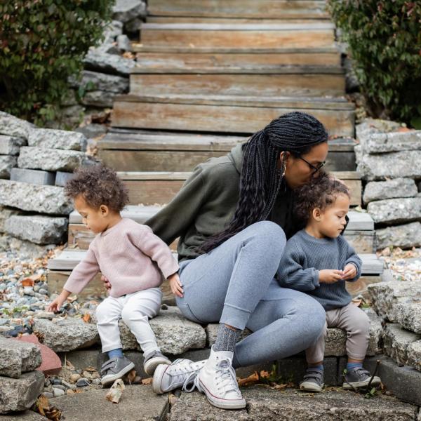 Parent with two young children