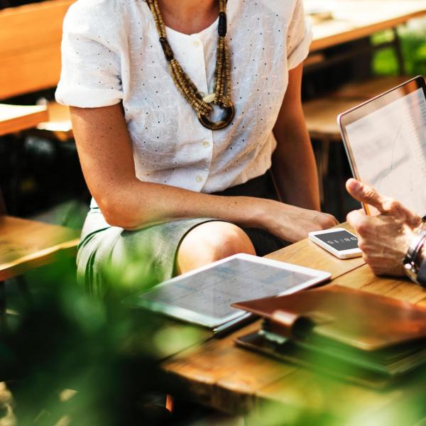Stock photo of a woman talking to a man at work.