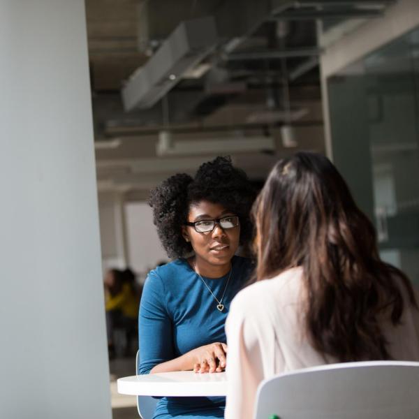 Two adults having a conversation