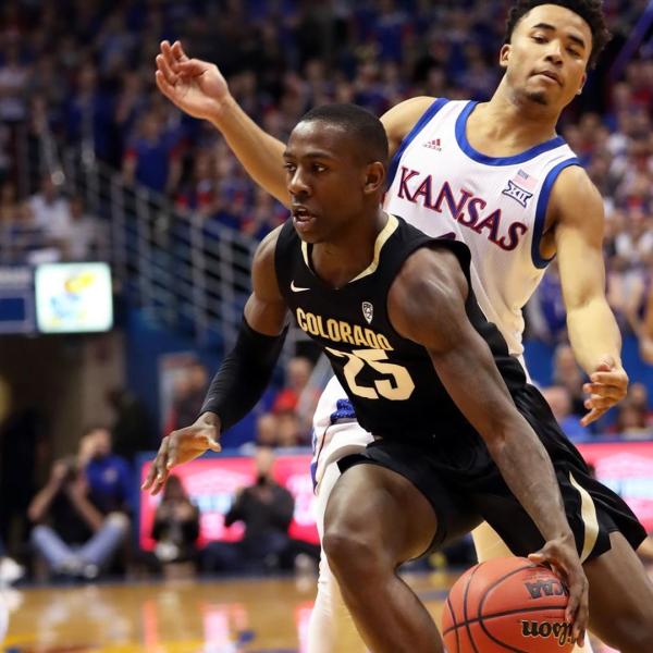 McKinley Wright IV driving to the basket against Kansas