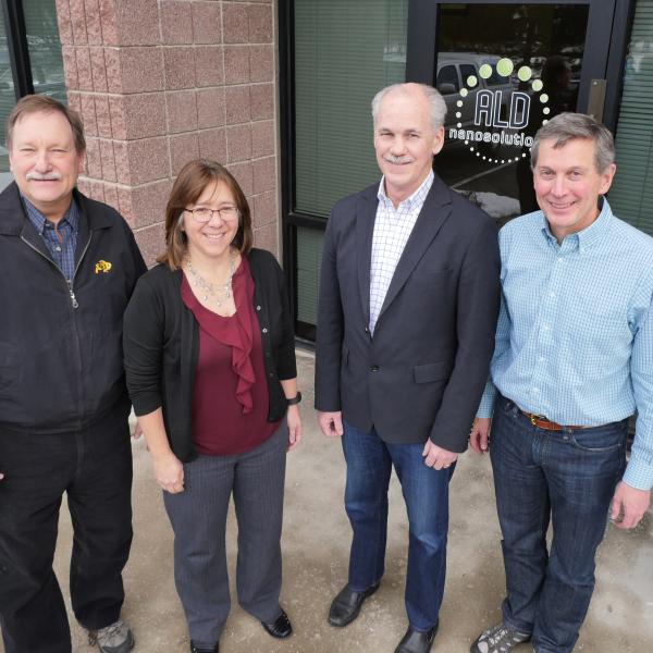 Professor Alan Weimer, CU Boulder alum Karen Buechler, CU Boulder alum Mike Masterson and Professor Steve George at ALD NanoSolutions in Broomfield, Colorado.