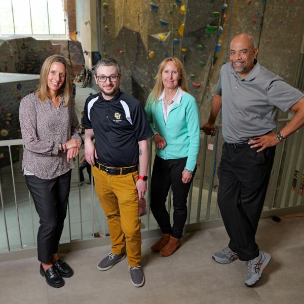 Grant winners Nicole LaRocque, Kyle Ginley, Patty McConnell and Tony Price in front of the Rec Center climbing gym