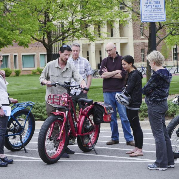 People participate in an alternative fuel vehicle ride-n-drive expo