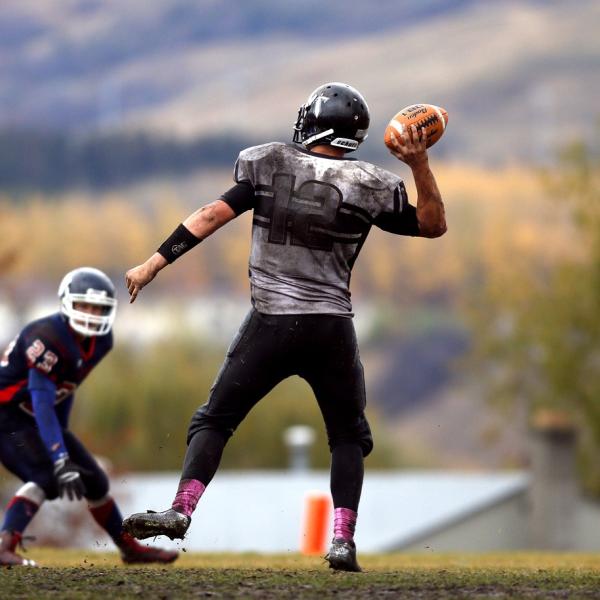teens playing football