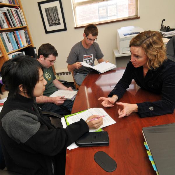 Advisor meets with students in her office