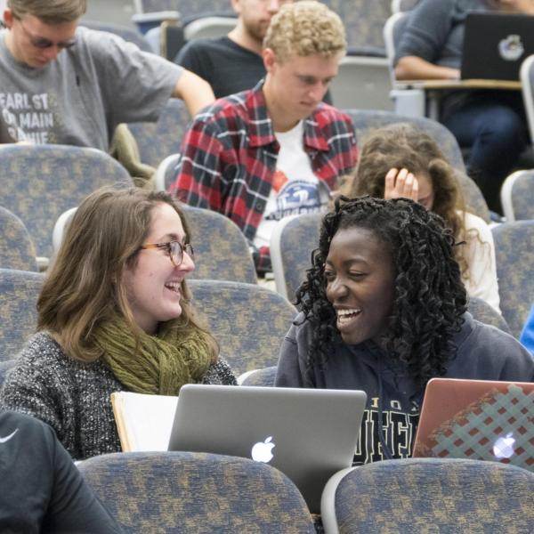 Students talk, sit in auditorium