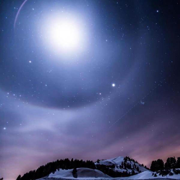 Bright star and snowy mountaintop