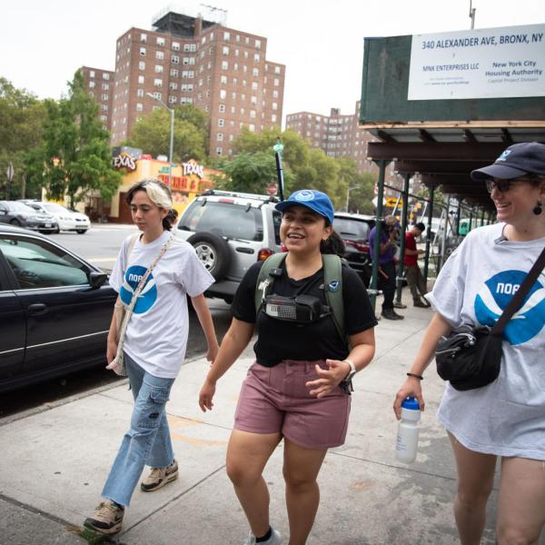 Researchers walk the streets of New York City taking air quality readings from a backpack