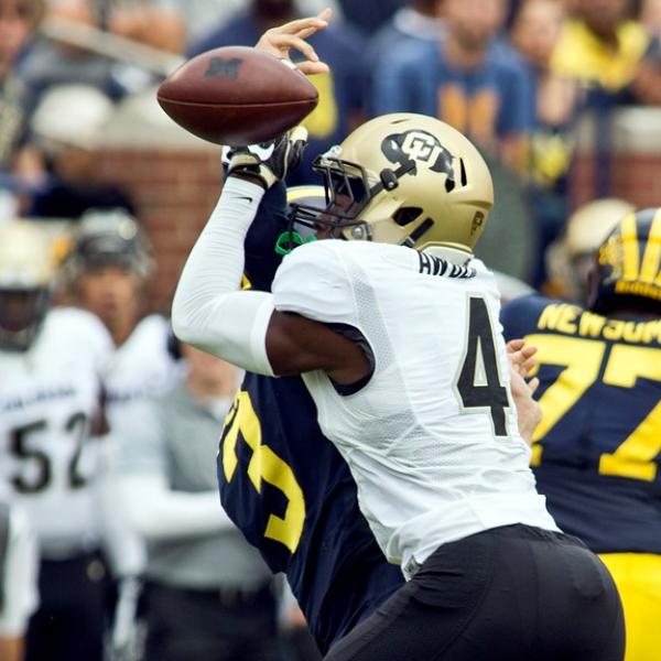 CU's Chidobe Awuzie collects a sack and forced fumble against Michigan earlier this year